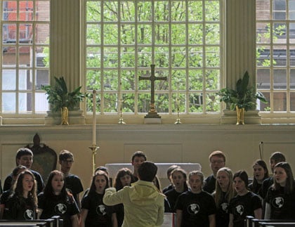 Students singing in a church
