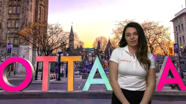 Tour Leader Tamara virtually stands in front of Ottawa sign for Brightspark's Student Virtual Tour