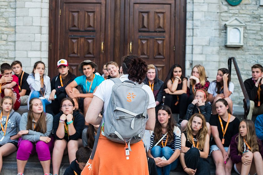 group leader talking to students 