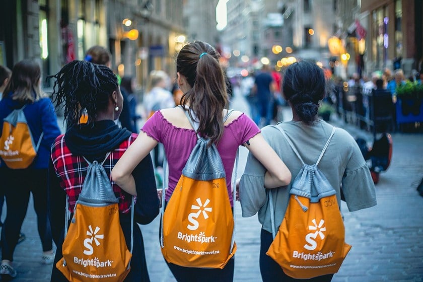 girls walking with arms locked