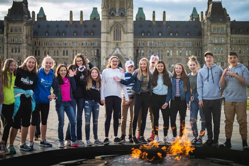 students by camp fire at parliament building