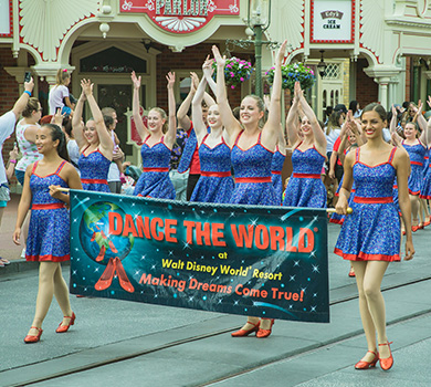 student dancers parading down Main St USA at the Walt Disney World Resort for Dance The World